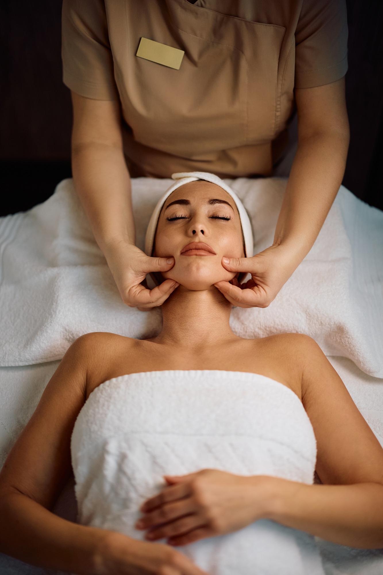 Young woman enjoying in beauty treatment at the spa.